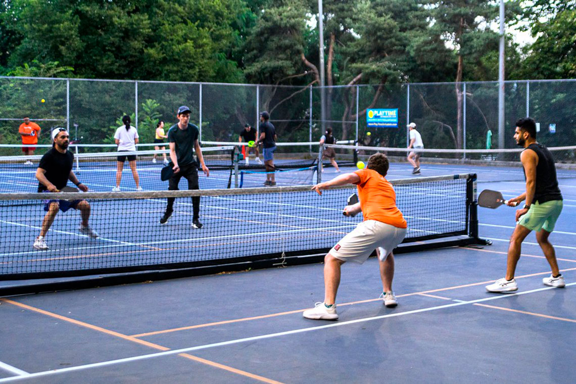 Pickleball match playing on court